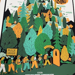 May include: A concert poster for Dave Matthews Band featuring a colorful illustration of hikers walking toward a mountain with a cabin, trees, and wildlife. Text includes "Mile High," "Colorado," "8.28.2026," and "Fiddler's Green Amphitheatre."
