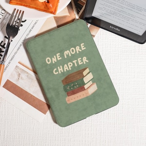 May include: A green Kindle cover featuring the words "ONE MORE CHAPTER" and a stack of illustrated books. The cover is rectangular with rounded corners. A Kindle e-reader is visible in the background.
