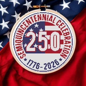 May include: A cross-stitch embroidery hoop featuring a patriotic design for the Semiquincentennial Celebration. The design includes the numbers "250" in red and white, surrounded by text and stars, set against a red, white, and blue background.
