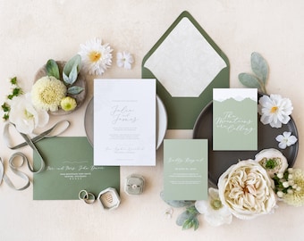 May include: Green and white wedding invitation suite with calligraphy text. The invitation reads "Julia and Jason" and the RSVP card reads "Kindly Respond". The details card reads "The Mountains are Calling".