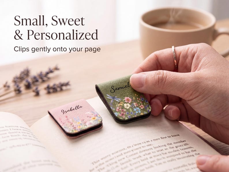 May include: Two magnetic page clips featuring floral patterns and personalised names. One clip is pink with the name Isabella, and the other is green with the name Samuel and a dragonfly illustration. Both clips are shown resting on an open book page.