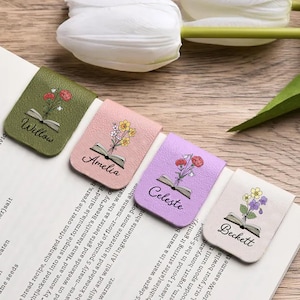 May include: Four rectangular magnetic bookmarks in olive green, soft pink, lavender, and cream. Each features a printed illustration of an open book with colourful flowers emerging from the pages and the names Willow, Amelia, Celeste, and Beckett.