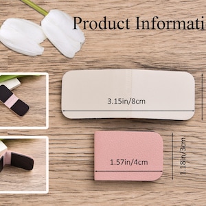 May include: A pink magnetic clip with a textured surface. The unfolded clip measures 8 cm by 3 cm, while the folded clip measures 4 cm by 3 cm. The interior features black magnetic panels for secure closure.