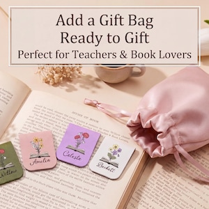 May include: Four rectangular magnetic bookmarks in olive green, light pink, lavender, and white, each featuring a floral illustration emerging from an open book and a name printed in black script: Willow, Amelia, Celeste, and Beckett. A pink satin drawstring pouch.