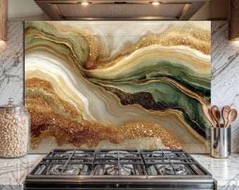 May include: A decorative kitchen backsplash with an abstract design. The artwork features flowing patterns in shades of gold, green, and white, with sparkling glitter accents. The backsplash is installed behind a black gas stove.