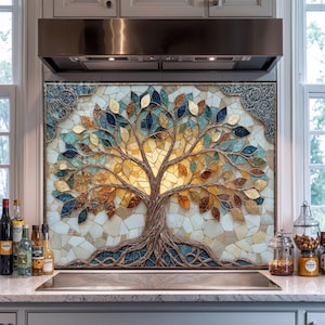 May include: A mosaic tree design backsplash with a golden sun. The tree has brown branches and roots, with blue, gold, and orange leaves. The background is a mosaic of white and beige tiles, framed with decorative trim.