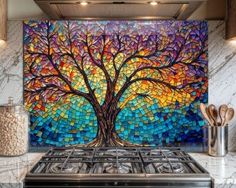 May include: A colorful kitchen backsplash featuring a mosaic tree design. The artwork showcases a tree with a brown trunk and branches, and a vibrant array of colors including blue, yellow, orange, and purple. The backsplash is installed above a black gas stove.