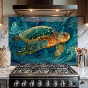 May include: A decorative kitchen backsplash featuring a sea turtle swimming in blue ocean waves. The turtle has a green and gold shell with a mosaic design. The background is a swirling pattern of blue and teal.