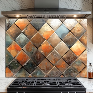May include: A decorative kitchen backsplash featuring a geometric pattern of square tiles. The tiles display a mix of colors, including orange, brown, gold, and blue, with a textured, metallic appearance. The backsplash is installed above a black stovetop.