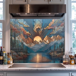 May include: A decorative kitchen backsplash features a mountain and lake landscape with a setting sun. The artwork has a blue, orange, and yellow color palette. The mountains and clouds are textured, and the sun's rays are visible.