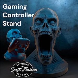 May include: A blue gaming controller stand shaped like a screaming skull. The stand holds a controller and has the words "Gaming Controller Stand" in white text. The logo "Craft Fusions and More!" is also visible.