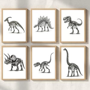 May include: Six framed art prints featuring detailed black and white illustrations of dinosaur skeletons. Each print showcases a different dinosaur species, including a Parasaurolophus, Stegosaurus, and Tyrannosaurus Rex, in a minimalist style with a white background.