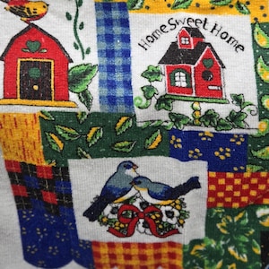 May include: A set of three ceramic mugs with a speckled, matte finish. The mugs are in shades of cream, light gray, and dark gray. Each mug has a simple, minimalist design and a rounded handle.