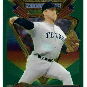 May include: A white ceramic mug with a black handle and the text "But First, Coffee" in a black, handwritten-style font. The mug is on a white surface.