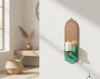 May include: A wall-mounted candle holder with a copper-colored top and a green bottom section. The holder has a hammered texture and a brass-colored candle cup. A white candle is in the holder. The logo "Copperra" is at the bottom.