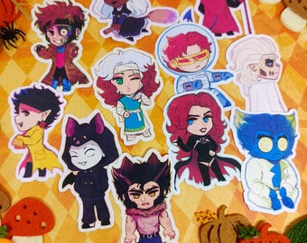 May include: A set of 12 Halloween-themed stickers featuring various characters in a cartoon style. The stickers are printed on white paper and have a glossy finish. The characters include a witch, a vampire, a werewolf, a zombie, a ghost, a devil, a skeleton, a cat, a pumpkin, a bat, a spider, and a Frankenstein's monster.