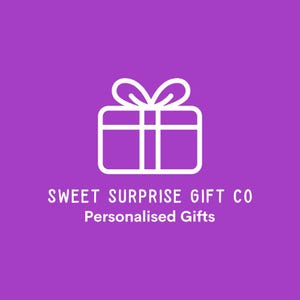 May include: A white line drawing of a gift box with a bow on a purple background. The text "SWEET SURPRISE GIFT CO" and "Personalised Gifts" is below the gift box.