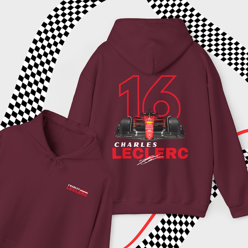 Puede incluir: Sudadera con capucha color burdeos con un n&uacute;mero 16 rojo, un coche de carreras rojo y el texto "Charles Leclerc" con una firma debajo.