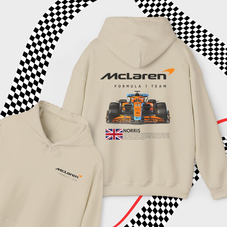 May include: A beige hoodie with a McLaren Formula 1 Team logo and a graphic of a race car. The hoodie also features a small Union Jack flag and the text "NORRIS".