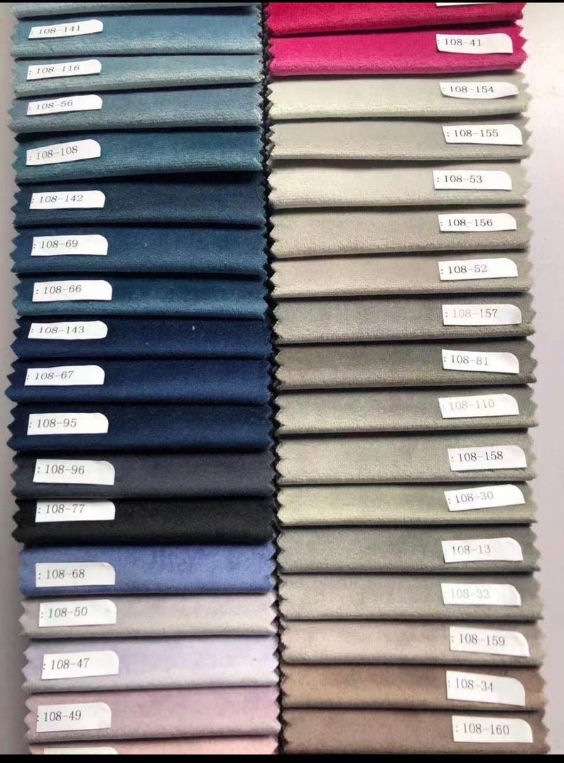 May include: A collection of fabric swatches in various colors, including shades of blue, gray, and pink. Each swatch has a label with a number. The swatches are arranged in vertical rows, showcasing a range of textures and hues.