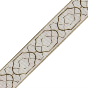 May include: Decorative ribbon featuring a repeating pattern of stylized, light brown geometric shapes outlined in a darker brown. The ribbon has a light beige background with subtle diagonal lines, creating a textured appearance. Ideal for crafts and home decor projects.