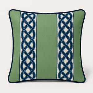 May include: A square decorative pillow with a green background and a navy blue border. Two vertical cream-colored stripes with navy blue Celtic knot designs run down the center. The pillow is a home decor item.
