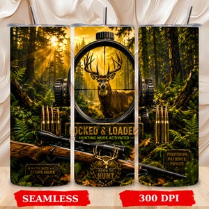 May include: A cylindrical tumbler featuring a forest scene with a deer viewed through a rifle scope. The design includes a rifle, bullets, and text reading LOCKED & LOADED HUNTING MODE ACTIVATED, THE BUCK STOPS HERE, BORN TO HUNT, and PRECISION PATIENCE POWER.