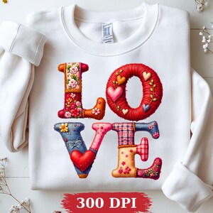 May include: White sweatshirt with the word "LOVE" in colorful, patchwork-style letters. The letters are decorated with floral patterns, hearts, and textured details. The image also includes the text "300 DPI" at the bottom.