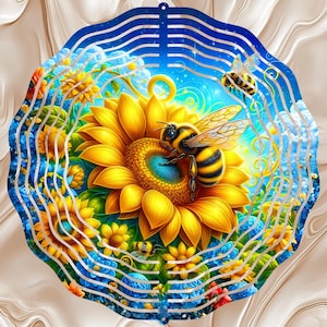 May include: A vibrant, circular metal art piece featuring a detailed illustration of a bee on a sunflower. The design incorporates yellow, blue, and green hues, with a layered, wavy border. The artwork evokes a sunny, natural theme.