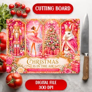 May include: A rectangular cutting board featuring a festive Christmas scene with a pink nutcracker, a ballerina, a decorated tree, and a rabbit wearing a crown. The text reads CHRISTMAS IS IN THE AIR, SPARKLE, DREAM & CELEBRATE. The design is framed in gold.