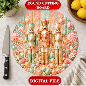 May include: A round cutting board featuring a festive illustration of three nutcrackers in pastel pink, mint green, and gold tones, surrounded by Christmas ornaments, snowflakes, and roses. The text ROUND CUTTING BOARD and DIGITAL FILE is visible.
