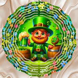 May include: A whimsical illustration of a leprechaun holding a green beer mug, standing near a wooden barrel. The leprechaun wears a green hat and suit, with a red beard and a smiling face. The image is framed by a floral border with a swirling background.