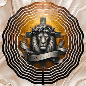 May include: A decorative metal wall art piece featuring a lion's head with a crown of thorns, set against a cross and a golden background. The words "MAN OF FAITH" are displayed on a banner. The artwork is framed by concentric brown and gold lines.