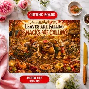 May include: A rectangular cutting board featuring a vibrant autumn illustration of squirrels in a forest setting. The text reads Leaves Are Falling, Snacks Are Calling. The scene includes pumpkins, a wagon, and a pie. The board is displayed on a white marble surface with a pink cloth and a knife.