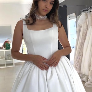 Minimalist Satin Wedding Dress with Square Neckline and Full Skirt | Elegant Bridal Gown with Train