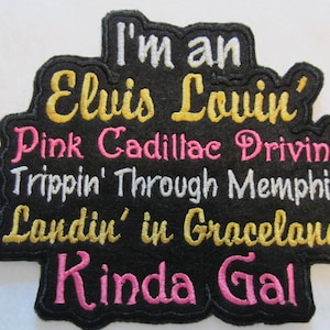 May include: Black patch with the text "I'm an Elvis Lovin' Pink Cadillac Drivin' Trippin' Through Memphis Landin' in Graceland Kinda Gal" in yellow, pink, and white lettering.