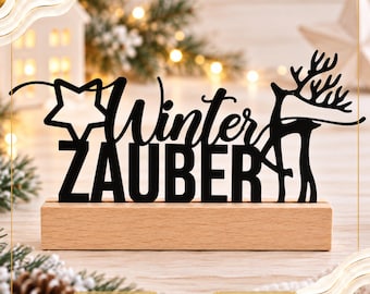May include: A black laser-cut decorative sign featuring the text Winter ZAUBER, a star, and a reindeer silhouette, mounted on a rectangular light wood base. The sign includes the text DIGITALE DATEI, SVG DATEI, and GEWERBELIZENZ.