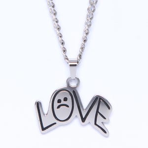 Collar de acero inoxidable con el mensaje "Lil Peep Love"