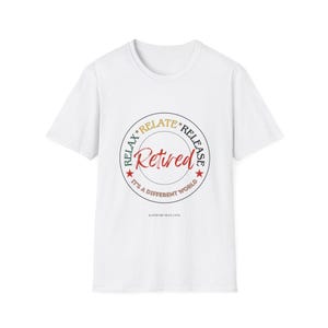 May include: White t-shirt with a circular graphic that reads "Retired" in red script. The graphic also includes the words "Relax, Relate, Release" and "It's a different world" in a circular design. The website address is at the bottom.