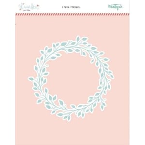 May include: A die-cut wreath design with light blue leaves and a white border, set against a soft pink background. The design is labeled with text in Spanish and English. The wreath is a decorative element.