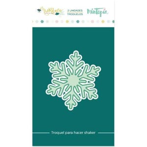 May include: A package featuring a die-cut snowflake design in shades of green and white. The package has text in Spanish, including "2 unidades" and "Troqueles". The background is teal.