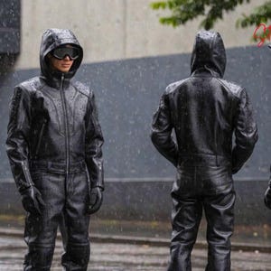 Men’s black leather hooded jacket and matching leather pants set in futuristic cyberpunk style, handmade goth streetwear outfit with tactical fashion design, black leather rave wear and biker fashion for men.