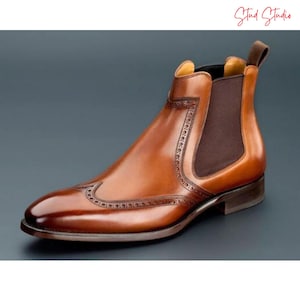 Handcrafted men’s leather boots with smooth full-grain leather, sturdy stitched sole, and timeless design for formal and casual wear.