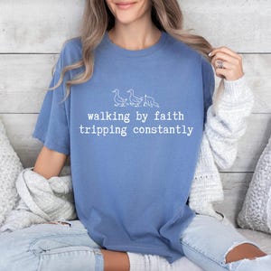 May include: A rustic wooden sign with the text "Welcome to our home" in white lettering. The sign features a distressed finish and a simple, inviting design, perfect for entryway decor.