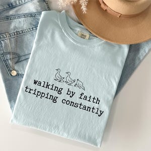 May include: A rustic wooden sign with the text "Welcome to our home" in white lettering. The sign features a distressed finish and a simple, inviting design, perfect for a front porch or entryway.