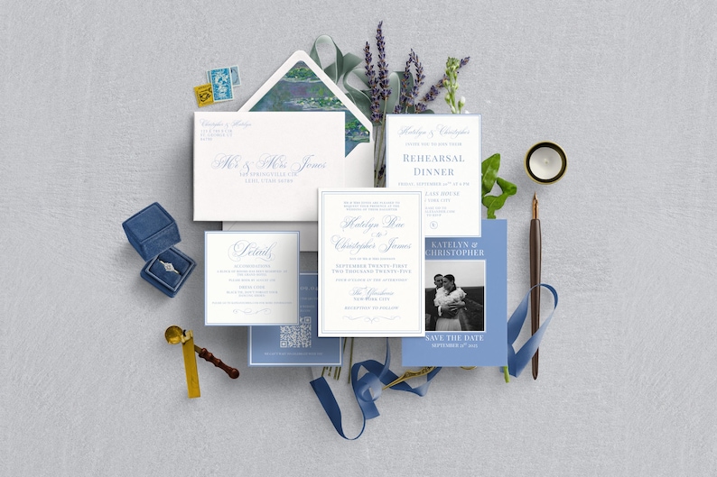 May include: Wedding stationery set featuring invitation cards, save-the-date cards, and an envelope with elegant calligraphy. A blue velvet ring box, a gold wax seal, and a pen with blue ribbon are also included. The theme is a wedding.
