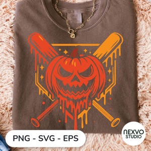 May include: A brown crewneck t-shirt featuring a graphic of a melting orange jack-o'-lantern centered over two crossed baseball bats. The design includes small star accents and a geometric border. The shirt has a Comfort Colors brand label at the neck.