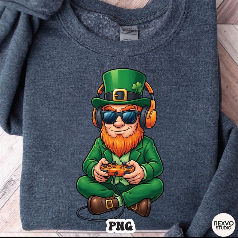 May include: Dark gray sweatshirt featuring a cartoon leprechaun wearing sunglasses, a green hat with a shamrock, and headphones. The leprechaun is holding a video game controller. The image has the text "PNG" at the bottom.