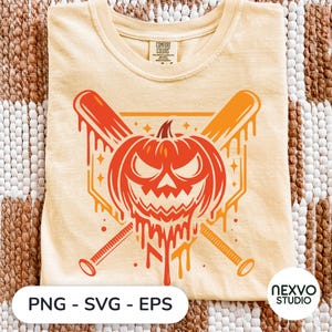 May include: A pale yellow t-shirt featuring a graphic of a melting orange pumpkin with a jagged, angry face positioned in front of two crossed baseball bats. The design includes small star accents and a geometric background shape behind the pumpkin.