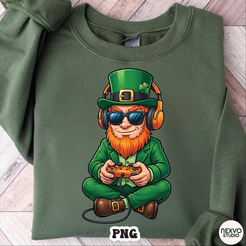 May include: Green sweatshirt featuring a cartoon leprechaun wearing sunglasses, headphones, and a green hat with a shamrock. The leprechaun is holding a game controller. The word "PNG" is printed at the bottom.